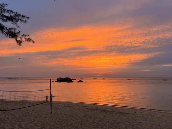 Scuba diving: Sunset over the sea, from the beach.