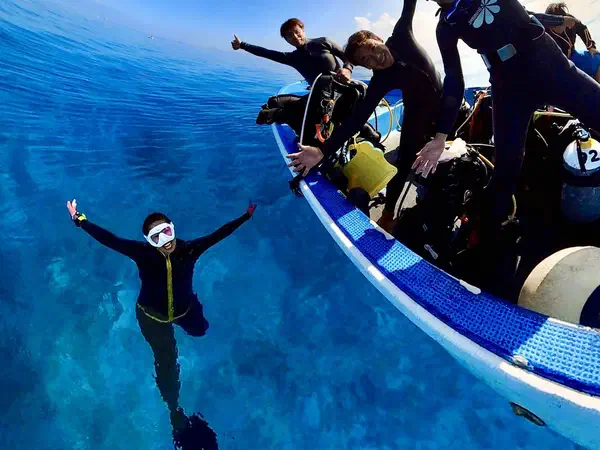 Scuba diving: Going in off the side of the boat.
