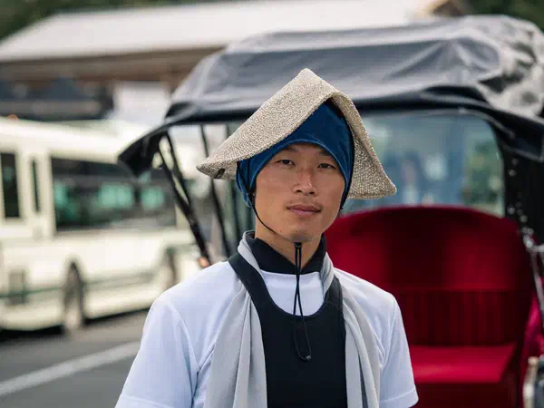 Photography: A rickshaw driver between fares, Kyoto.