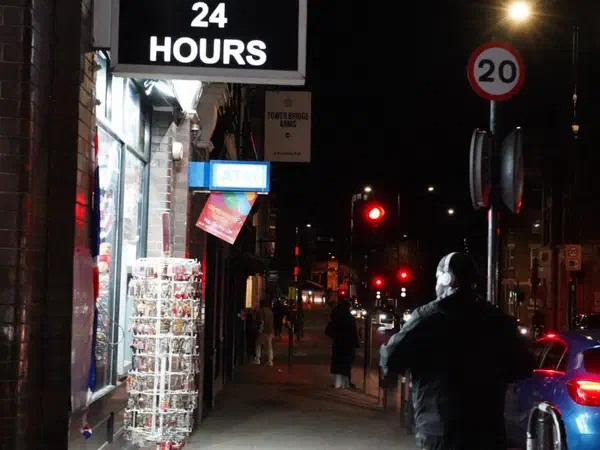 Photography: Past an all-night shop, London.