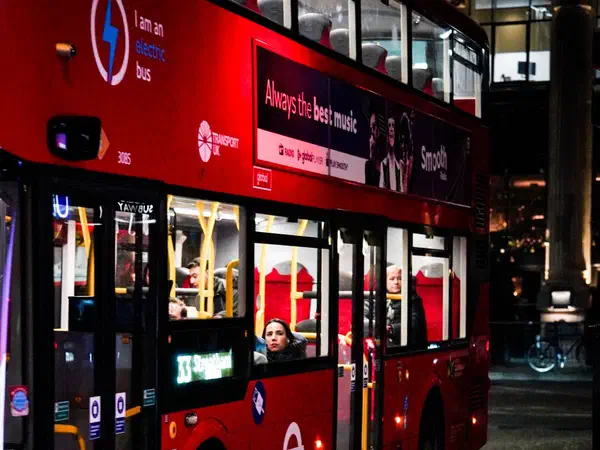 Photography: A double-decker bus pulling away at night, London.