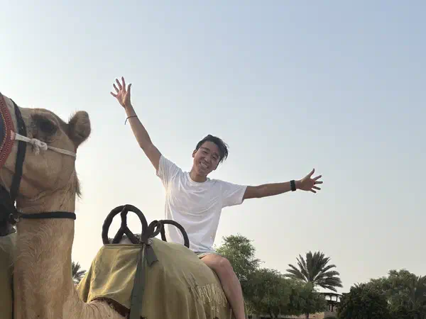 Dubai, United Arab Emirates: A camel ride in the desert outside Dubai.
