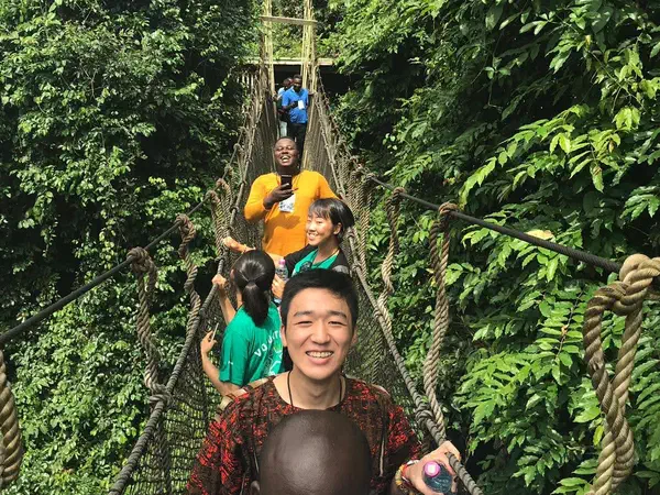 Cape Coast, Ghana: Crossing a rope walkway high above the rainforest.