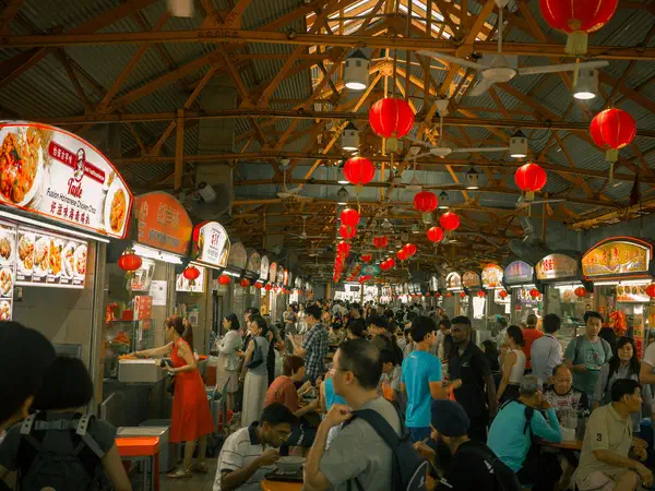 Singapore: Lunchtime under the red lanterns of a hawker centre.
